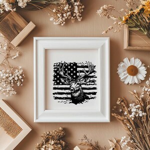 May include: A black and white illustration of a deer's head with antlers, superimposed on a distressed American flag design. The image is framed in a white frame.