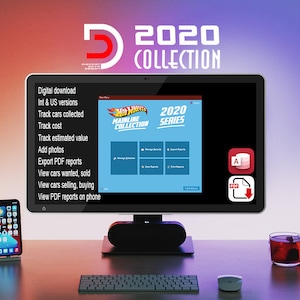 May include: A computer screen displaying a software program for tracking a Hot Wheels Mainline Collection. The program features a blue interface with buttons for managing records, exporting reports, and viewing reports. The screen is on a desk with a keyboard, a mouse, a smartphone, and a cup of tea.