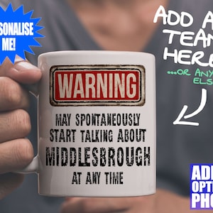 May include: White ceramic mug featuring a black and red "WARNING" sign design. The text reads "MAY SPONTANEOUSLY START TALKING ABOUT MIDDLESBROUGH AT ANY TIME." Additional text on the image says "PERSONALISE ME!" and "ADD ANY TEAM HERE!"