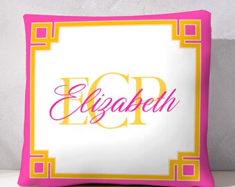 May include: Pink and yellow decorative cushion with a white centre featuring the name "Elizabeth" in a stylised font.