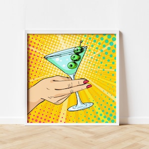 May include: A pop art illustration of a hand holding a martini glass with green olives. The background is a yellow, red, and blue polka dot pattern.