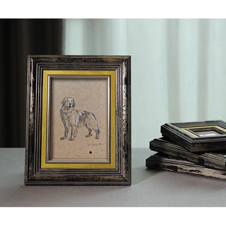 May include: A black and gold picture frame with a drawing of a dog inside. The frame has a distressed look and is made of wood.