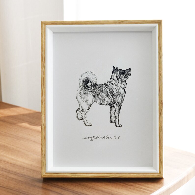 May include: A black and white pencil drawing of a dog in a white frame with a wood border. The drawing is signed "_ong chunsil 9.6".