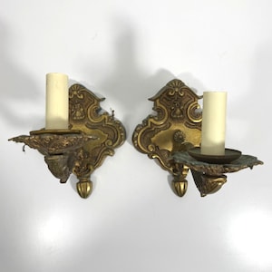 May include: A set of three ceramic mugs with a speckled, matte finish. The mugs are in shades of cream, light gray, and dark gray. Each mug has a simple, minimalist design, perfect for coffee or tea.