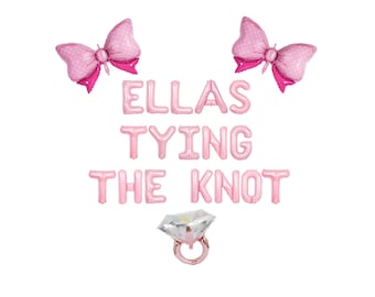 May include: Pink balloon letters spelling "Ellas Tying the Knot" with two pink bow balloons and a pink diamond ring balloon.