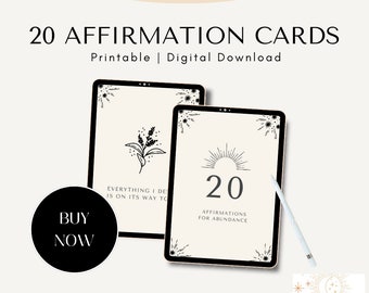 May include: Two digital screens displaying printable affirmation cards. The screens are on a white background. The text on the screens reads "Everything I desire is on its way to me" and "20 Affirmations for Abundance".