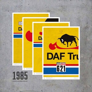May include: Four yellow and blue posters with a black bull illustration and the text "DAF Trucks" and "VSD Olympia 621". The posters also have the text "1985 Paris-Alger-Dakar".