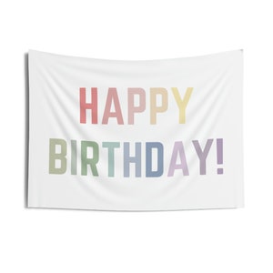 May include: A white banner with the text "HAPPY BIRTHDAY!" in rainbow colors.
