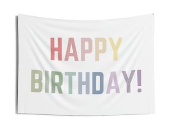 May include: A white banner with the text "HAPPY BIRTHDAY!" in rainbow colors.