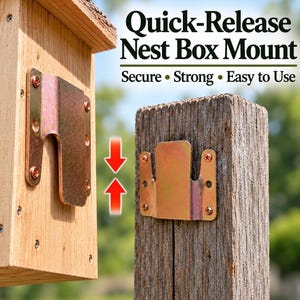 May include: A gold-toned metal quick-release nest box mount consisting of two interlocking brackets. One bracket is attached to a wooden birdhouse and the other to a wooden post. The text reads Quick-Release Nest Box Mount Secure Strong Easy to Use.