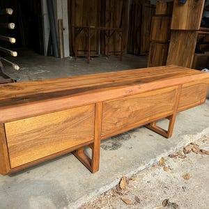 Solid walnut furniture top view showing warm brown color tone