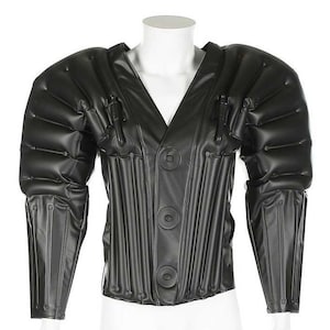 May include: A black, inflatable jacket with a zipper closure and a v-neck. The jacket has a series of vertical panels and a series of horizontal panels on the shoulders and sleeves.