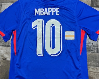 Camiseta de fútbol de Francia firmada por Kylian Mbappé con certificado de autenticidad.