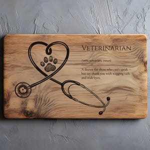 May include: Wooden chopping board featuring the word "VETERINARIAN" and a stethoscope design. The stethoscope forms a heart shape around a paw print. The definition of veterinarian is also included.