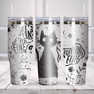 May include: Three stainless steel tumblers with black and white designs. The tumblers feature a black cat, a black and white floral design, and a black and white design with the text "It's Fine" and "Everything's Fine".