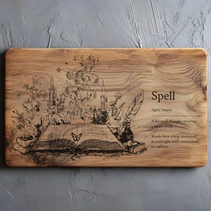 May include: Rectangular wooden chopping board with an engraved design featuring an open book, candles, and a butterfly. The word "Spell" is displayed with a definition. The board has a natural wood grain.