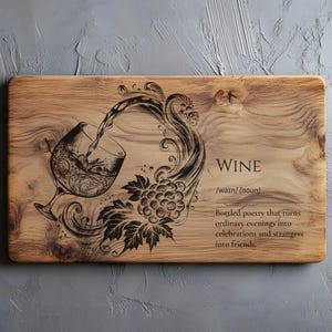 May include: Wooden serving board with a decorative wine-themed design. The board features an etched illustration of a wine glass with flowing liquid, grapes, and the word "WINE". The text below reads "Bottled poetry that turns ordinary evenings into celebrations and strangers into friends."