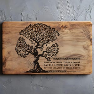 May include: Wooden rectangular cutting board with a tree design and the words "Faith, Hope, Love" etched into the wood. The text "And now these three remain: Faith, Hope and Love. But the greatest of these is love. Corinthians 13:13" is also etched.
