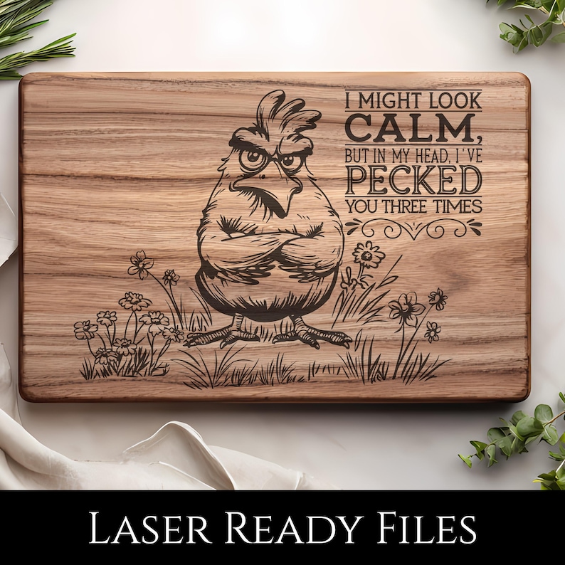 May include: A rectangular wooden cutting board with a laser-etched design. The design features an angry cartoon chicken with crossed arms, surrounded by grass and flowers. Text reads "I MIGHT LOOK CALM, BUT IN MY HEAD, I'VE PECKED YOU THREE TIMES."