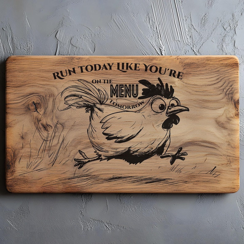 May include: Wooden cutting board with a cartoon chicken illustration and the text "Run today like you're on the menu tomorrow." The board is rectangular with rounded corners and a natural wood grain finish.