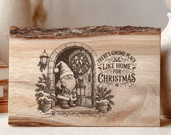 May include: A rectangular live-edge wood plaque featuring a laser-engraved illustration of a gnome standing in a doorway with a lantern. The text reads, There's Gnome-Place Like Home For Christmas, surrounded by decorative flourishes and pine trees.