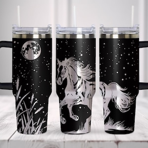 May include: Three stainless steel travel mugs with black lids and handles. The mugs feature a black background with a white silhouette of a horse running under a full moon and stars. The mugs are 20 oz.