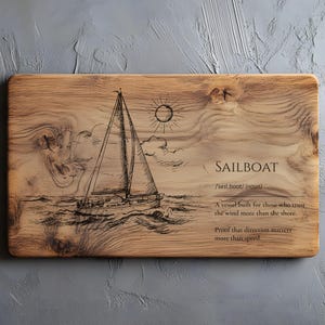 May include: A rectangular wooden cutting board with a sailboat etched into the surface. The design includes a sun, clouds, and the word "SAILBOAT" with a definition and quote. The board has a natural wood grain.