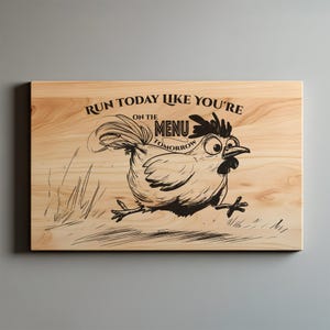 May include: Wooden cutting board with a cartoon chicken running. The text reads "Run today like you're on the menu tomorrow." The chicken is black and white, and the board has a natural wood grain.