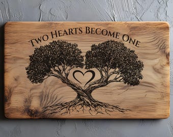 May include: Wooden cutting board with a tree design. Two trees with intertwined branches forming a heart shape are etched into the wood. The text "TWO HEARTS BECOME ONE" is above the trees. The board has a rectangular shape and a natural wood grain.