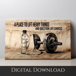 May include: Wooden print featuring a dumbbell, water bottle, and towel. The text reads "A PLACE TO LIFT HEAVY THINGS AND QUESTION LIFE CHOICES." The words "DIGITAL DOWNLOAD" are at the bottom.