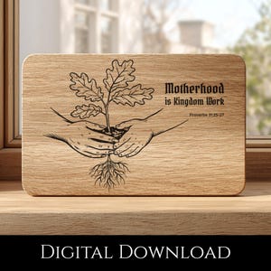 May include: Wooden chopping board with a laser-etched design. The design features a plant held by two hands, with the text "Motherhood is Kingdom Work" and "Proverbs 31:25-27". The words "DIGITAL DOWNLOAD" are at the bottom.