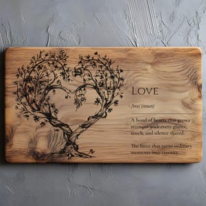 May include: A rectangular wooden plaque featuring a heart-shaped tree design. The word "LOVE" and its definition are printed on the wood. The tree is dark brown against the light brown wood, giving a rustic feel.