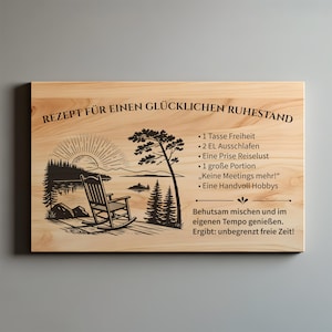 May include: A rectangular light-colored wooden plaque featuring a black engraved illustration of a rocking chair on a dock overlooking a lake at sunrise. The text reads: REZEPT F&Uuml;R EINEN GL&Uuml;CKLICHEN RUHESTAND, followed by a list of ingredients and instructions.