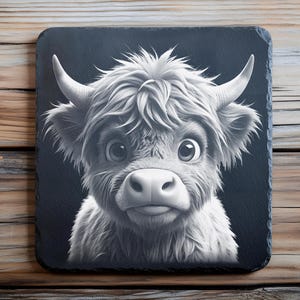 May include: A black and white illustration of a Highland cow with fluffy fur and big eyes. The cow is looking directly at the viewer with a friendly expression.