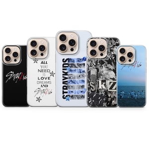 May include: Five phone cases with different designs. The cases display the text "Stray Kids" and other graphics, including eyes, a group photo, and the phrase "All You Need Is Love Dreams And Stray Kids."