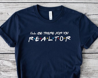 May include: Navy blue t-shirt with white text that reads "I'll be there for you REALTOR" in a font reminiscent of the popular TV show "Friends".