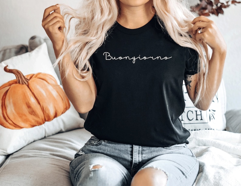 May include: A black t-shirt with the text "Buongiorno" written in white cursive script.