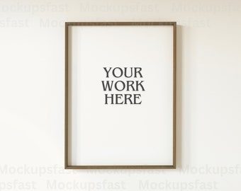 May include: A brown wood frame with a white mat and the text "YOUR WORK HERE" in black.