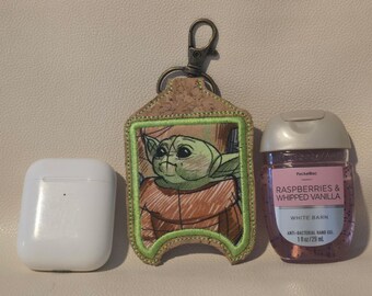Green alien sanitizer/airpod holder