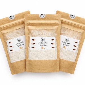 May include: Three brown kraft paper stand-up pouches containing white egg shell calcium powder. Each pouch features a white label with the text Snail sprinkles Egg shell calcium, accompanied by small brown snail illustrations and a circular logo.