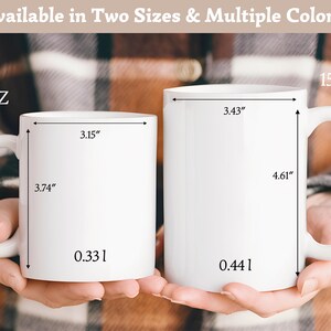 May include: Two white ceramic mugs with handles. The smaller mug is labeled 11 oz and 0.33 l, with dimensions of 3.15 inches wide and 3.74 inches high. The larger mug is labeled 15 oz and 0.44 l, with dimensions of 3.43 inches wide and 4.61 inches high.