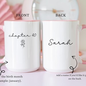 May include: Two white ceramic mugs with pink handles and rims. The left mug features the text 'chapter 40' above a small line-art rose illustration. The right mug displays the name 'Sarah' in black script. Both mugs have a smooth, glossy finish.