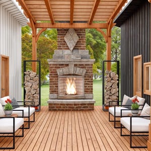 May include: An outdoor patio space featuring a wooden pergola, a central brick fireplace with a burning fire, and two black metal racks filled with stacked firewood. Four white cushioned chairs with black frames are arranged on the wooden deck.