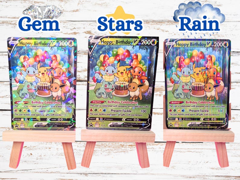May include: Three Happy Birthday V trading cards displayed on small wooden easels. Each card features Pikachu, Squirtle, Charmander, Bulbasaur, and Eevee with a birthday cake and balloons. The cards have distinct holographic patterns: Gem, Stars, and Rain.
