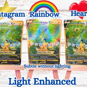 May include: Three Pikachu and Pichu trading cards displayed on small wooden easels. Each card features the characters in a forest, the text Happy Father's Day, Static Hug, and 200 HP. The cards show holographic star, rainbow, and heart patterns.