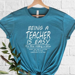 Being A Teacher Is Easy It's Like Riding A Bike Except The Bike Is On Fire T-Shirt, Teacher Shirt, Teacher Appreciation, Gift For Teacher