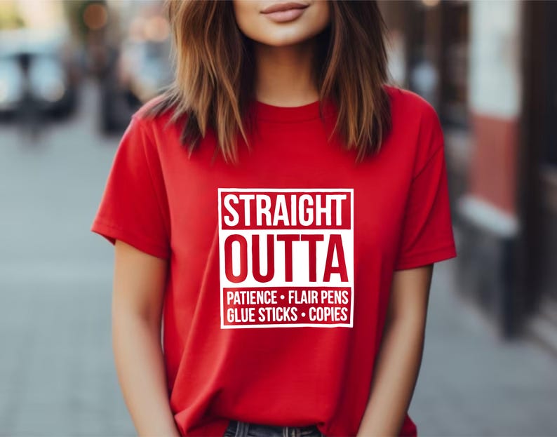 May include: A red t-shirt with the text "STRAIGHT OUTTA" in a white box, followed by "PATIENCE &bull; FLAIR PENS &bull; GLUE STICKS &bull; COPIES" in white. The shirt is short-sleeved.