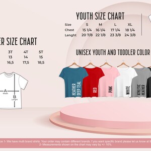 May include: Size chart for toddler and youth t-shirts. The chart shows chest and length measurements in inches for sizes 2T, 3T, 4T, 5T, S, M, L, and XL. The chart also shows color options for the t-shirts, including Heather Deep Teal, Red, Pink, White, Athletic Heather, Dark Grey Heather, and Black.