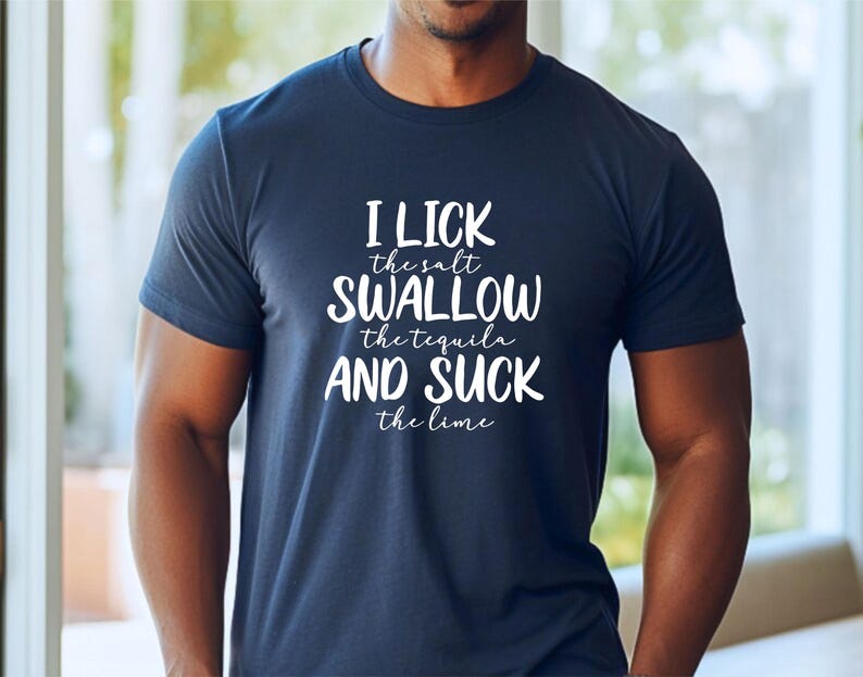 May include: A navy blue t-shirt with white text that reads "I lick the salt swallow the tequila and suck the lime".