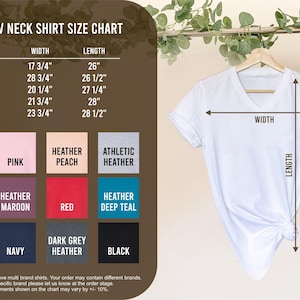 May include: A size chart for women's V-neck shirts with measurements in inches. The chart shows the width and length of the shirts in different sizes, from S to 2X. The chart also includes a colour chart with different colour options for the shirts, including white, pink, heather peach, athletic heather, heather mauve, heather maroon, red, heather deep teal, heather navy, navy, dark grey heather, and black.